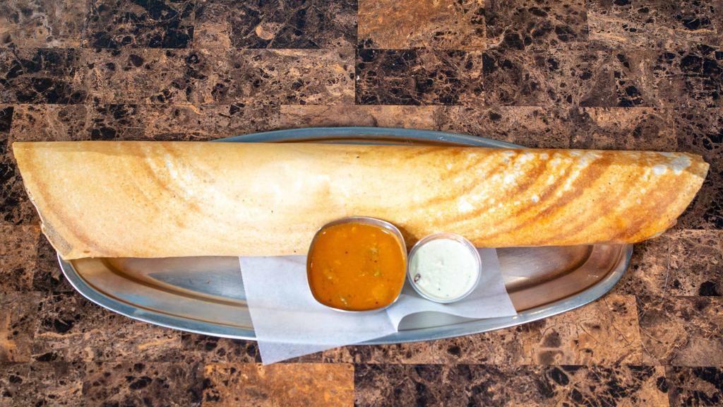 Paper Masala Dosa · Paper-thin, crispy, 2-foot long, lentil and rice crepe. Served with sambar and chutney. Served with spiced potatoes, sambhar and chutney.