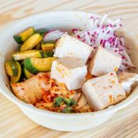 Tofu Bap · Soy and sesame tofu, chilled sweet and spicy noodles, kimchi, zucchini, and radish.