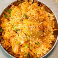 Kimchi Fried Rice · Served with rice, vegetables, and egg.
