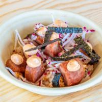 Spam Musabi · Fried spam on rice with spicy mayo, radish, and nori.