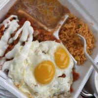 Chilaquiles Skillet · Two eggs any style, tortilla, simmered in red or green salsa sauce, cheese, onion, pico de g...