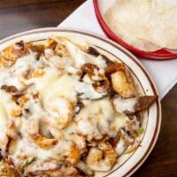 Camarones Al Queso · Grilled shrimp cooked with sauteed onions and mushrooms topped with Monterey jack cheese. Se...