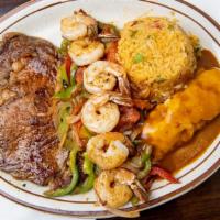 El Tequila Steak · Ribeye steak and grilled shrimp with tomatoes, bell peppers, and onions. Served with rice an...