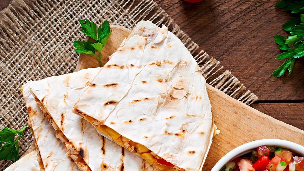 Cheese Quesadilla · A large flour tortilla stuffed with tomatoes and cheese. Served with sour cream and house-made salsa.  - Or add Steak, Beef, Chicken, Pulled Pork or Pulled Chicken
