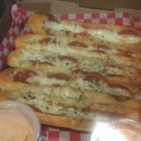 Pepperoni Stuffed Bread Sticks · Vinny's drive bar favorite. We stuff these with pepperoni, garlic butter and mozzarella chee...