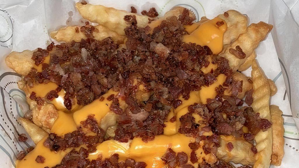 Loaded Fries · Our Basket of Fries topped with Spicy Nacho Cheese and Bacon