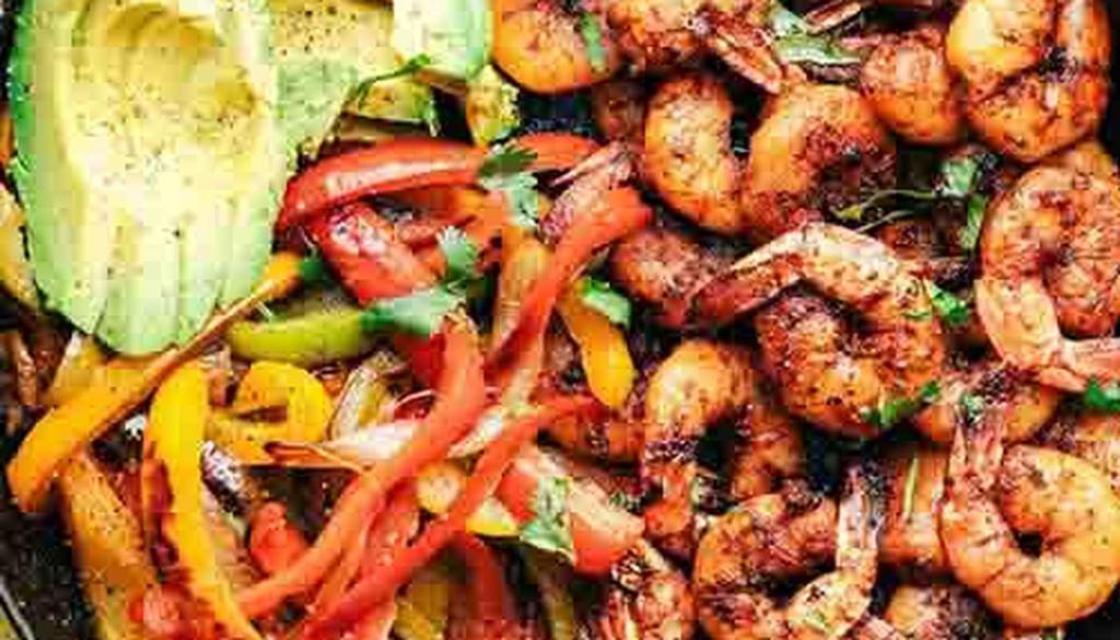 Shrimp Fajitas · Shrimp grilled with onions and green peppers. Served sizzling hot with salsa fresca, sour cream, and choice of Tortillas.