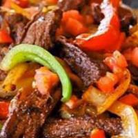 Steak Ala Mexicana · Succulent chunks of steak sauteed in our tangy salsa ranchero.