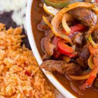 Pollo Ranchero · One-half chicken simmered in our tangy salsa ranchero served with rice, beans, and tortillas.