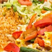 Huevos A La Mexicana · Three eggs grilled with diced onions, green peppers, tomatoes, and jalapenos with rice, bean...