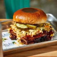 Smokehouse · Barbecued brisket, pickles, coleslaw, and bbq sauce on a brioche bun