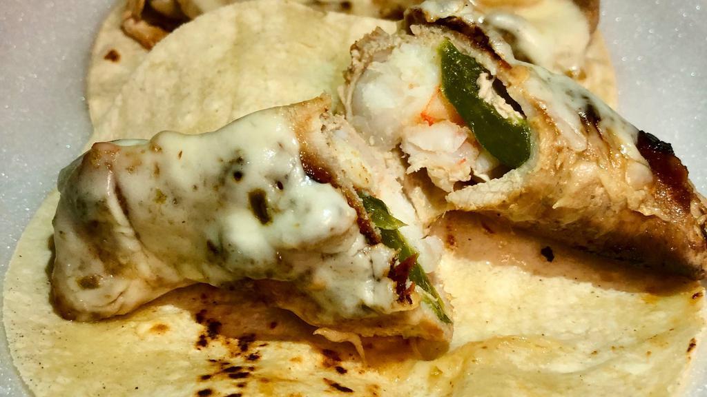 Stuffed Piggies (Pork Wraps) · Pork steak stuffed with shrimp, slice of jalapeño and Monterrey Jack cheese, topped with grilled onions and service in a warm corn tortilla.