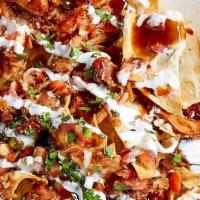 Bbq Pork Nachos · Slow-Roasted Pork Over Fresh Fried Tortilla Chips, Layered With A Five Cheese Blend & Topped...