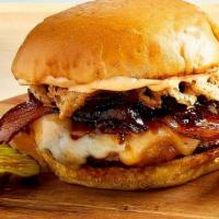 Platinum Bacon Burger · Ground Chuck, Aged Cheddar, Swiss, Smoked Bacon, Bacon Jam, Bacon Aioli & Onion Crisps. Serv...