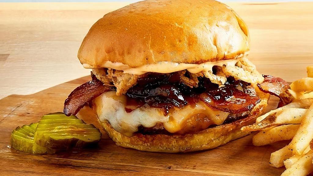 Platinum Bacon Burger · Ground Chuck, Aged Cheddar, Swiss, Smoked Bacon, Bacon Jam, Bacon Aioli & Onion Crisps. Served On A Grilled Pub Bun.