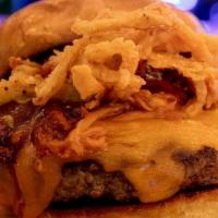 Bbq Burger · Ground Chuck, Aged Cheddar, Pulled BBQ Pork, BBQ Sauce & Onion Straws. Served On A Grilled P...