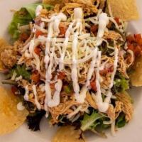 Southwest Salad · Garden Greens On A Bed Of Fresh Fried Tortilla Chips, Grilled Chicken Or Taco Seasoned Groun...