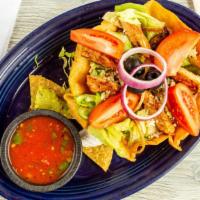 B-6. Chicken Fajita Salad · Chicken fajitas sautéed with bell peppers and Spanish onions. Served on a bed of chopped let...
