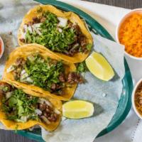 3 Tacos Dinner · With rice and beans, Choice of chicken, ground beef or steak with an extra charge, with raw ...