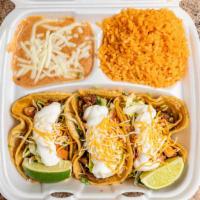 3 Supreme Tacos Dinner · Served with rice and beans, choice of chicken, ground beef or steak with an extra charge, wi...