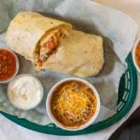 Grande Burrito · Choice of chicken, ground beef, or steak with an extra charge, with lettuce, tomatoes, shred...