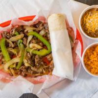 Steak Fajitas · Steak, served with sautéed peppers and onions, and three tortillas. (choice of flour or corn).