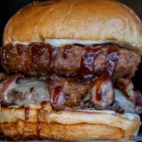 Bbq Rodeo Burger · District Sauce, cheese, bacon, onion rings, bbq sauce.