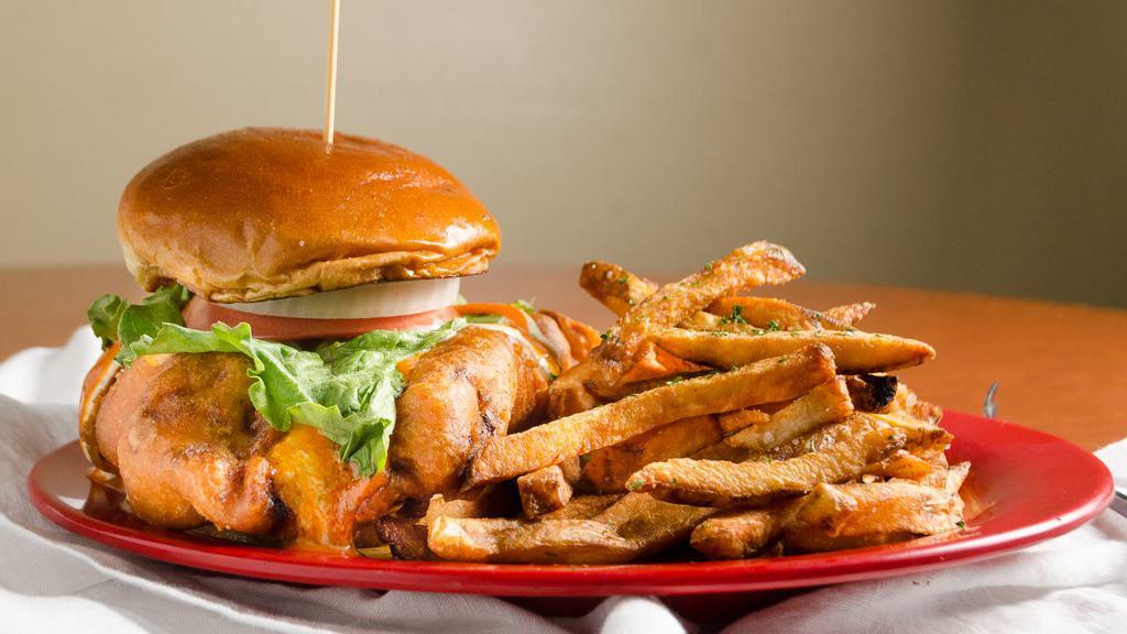Buffalo Chicken · Come hungry for this one. A battered then fried chicken breast topped with your choice of hot or mild buffalo, ranch or blue cheese dressing, with lettuce, tomato, and onion on a brioche bun.