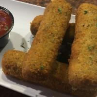 Cheese Sticks · Hand-cut mozzarella cheese, breaded and deep-fried. Served with marinara.