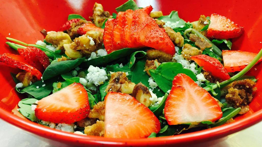 Candied Walnut & Strawberry Salad · Candied walnuts and fresh sliced strawberries, tossed with mixed greens and blue cheese crumbles, with raspberry vinaigrette. Add large size for an additional charge.