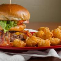 Bbq Bacon Burger · Certified Angus Beef® patty topped with cheddar, bacon, onion crisps and bbq sauce, with let...