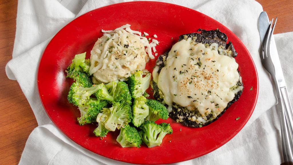 Stuffed Portobello · Portobello mushroom caps stuffed with a savory blend of garlic, herbs, melted mozzarella, and a blue cheese and roasted rep pepper cream sauce. Served with garlic mashed potatoes, and broccoli.