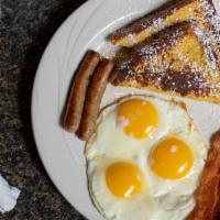 French Toast, Eggs & Meat · Two slices of French toast, dipped in our special batter, served with two eggs, two bacon st...