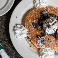 Oreo Pancakes · Served with crumbled Oreo cookies, whip cream and powdered sugar.
