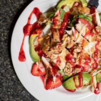 Tropical Walnut Chicken Salad · Grilled chicken breast, avocado, walnuts, and fresh straw-berries. Served on lettuce and mix...