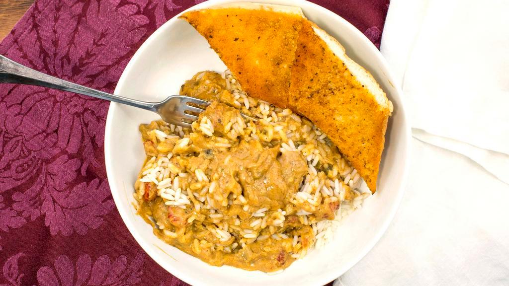 Chili Cheese Étouffée With Crawfish · A rich blonde roux-based sauce with chili seasonings, cumin and coriander, finished with cheddar cheese and crawfish tail meat.  Quart size includes 1 quart of rice, 1 quart of the entree, and bread.