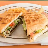 Tortas · Mexican bread, bean spread and stuffed with meat.