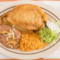 Chile Relleno · Poblano pepper stuffed with cheese taco topped with lettuce and tomato