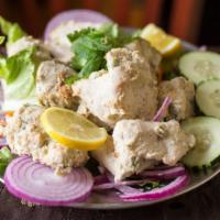 Chicken Malai Kabob · Gluten free. Skewered boneless chicken marinated in vinegar, lemon juice, garlic, ginger, eg...