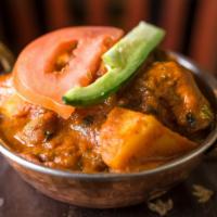 Chicken Vindaloo · Gluten free. Spicy! Marinated chicken and potatoes with fresh herbs, vinegar, and spices.