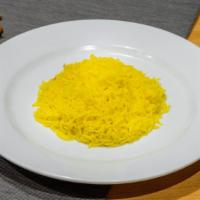 Saffron Rice · Gluten free. Basmati rice cooked with saffron threads, cardamom, and cloves.