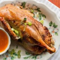 Roast Wisconsin Duck · Farm raised, one half duckling, plump and meaty. Roasted until golden brown with sage stuffi...
