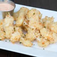 Cheese Curds · White cheddar cheese curd + beer batter + sriracha ranch.