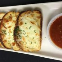 Cheesy Garlic Bread · Topped with Mozzarella. Served with Marinara.
