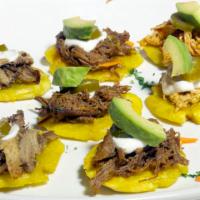 Green Plantains Tapas · Crispy Fried plantains, topped with choice of meat, salsa, sour cream, avocado, and
jalapenos