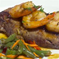 New York Steak With Shrimp In Garlic Sauce · Grilled New York steak , topped with shrimp sautéed in a garlic butter sauce.
Served with Ch...