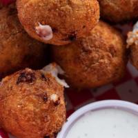 Philly Cheese Balls · Hand bread, deep fried mozzarella and Provolone cheese balls. Served with Ranch Dressing. 9 ...