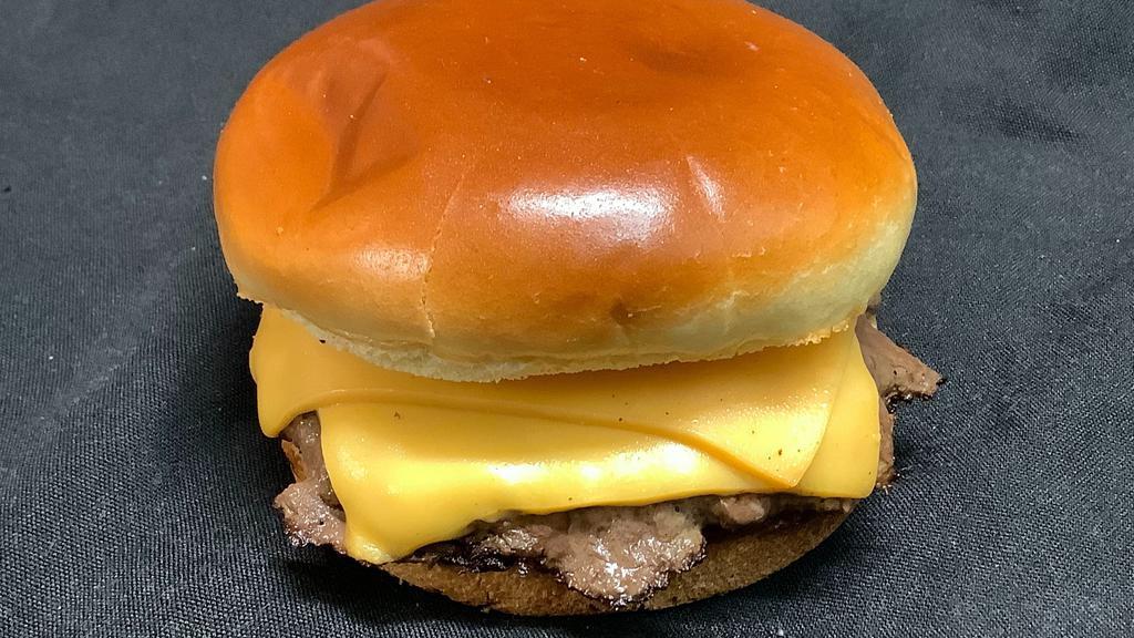 Cheesy Double Decker Burger · Double Decker Burger, American Cheese, Pickle and Ketchup on a Brioche bun