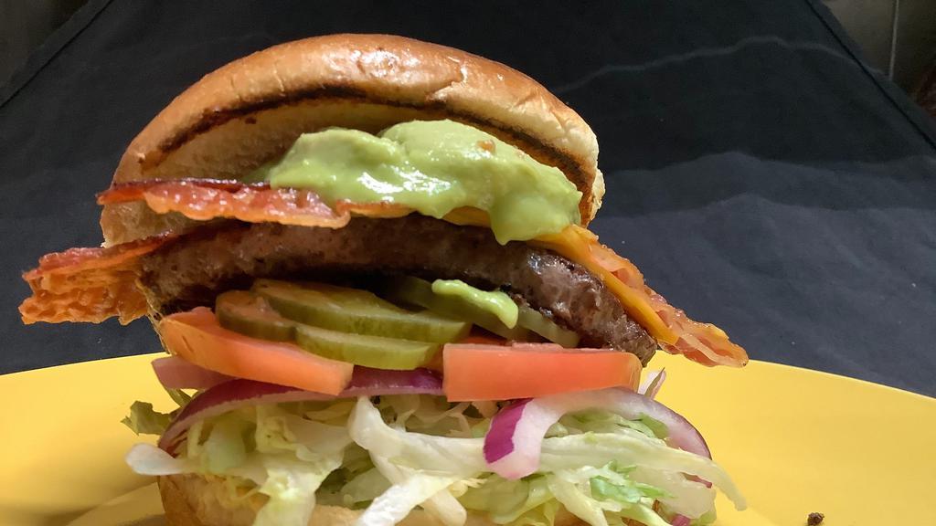 Bacon Avocado Burger · Double Decker Burger, Lettuce, Onion, Tomato, Pickle, Ketchup, Mayo, American Cheese, Bacon and Avocado on a Brioche bun