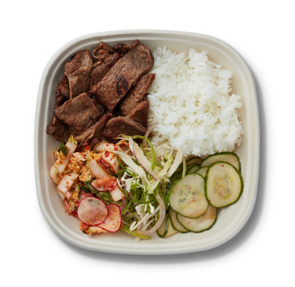Kalbi · (GF) Short Ribs marinated in a savory soy base with garlic & ginger. Recommended with Kimchi Slaw* & Seasoned Cucumber. . *Gluten Free